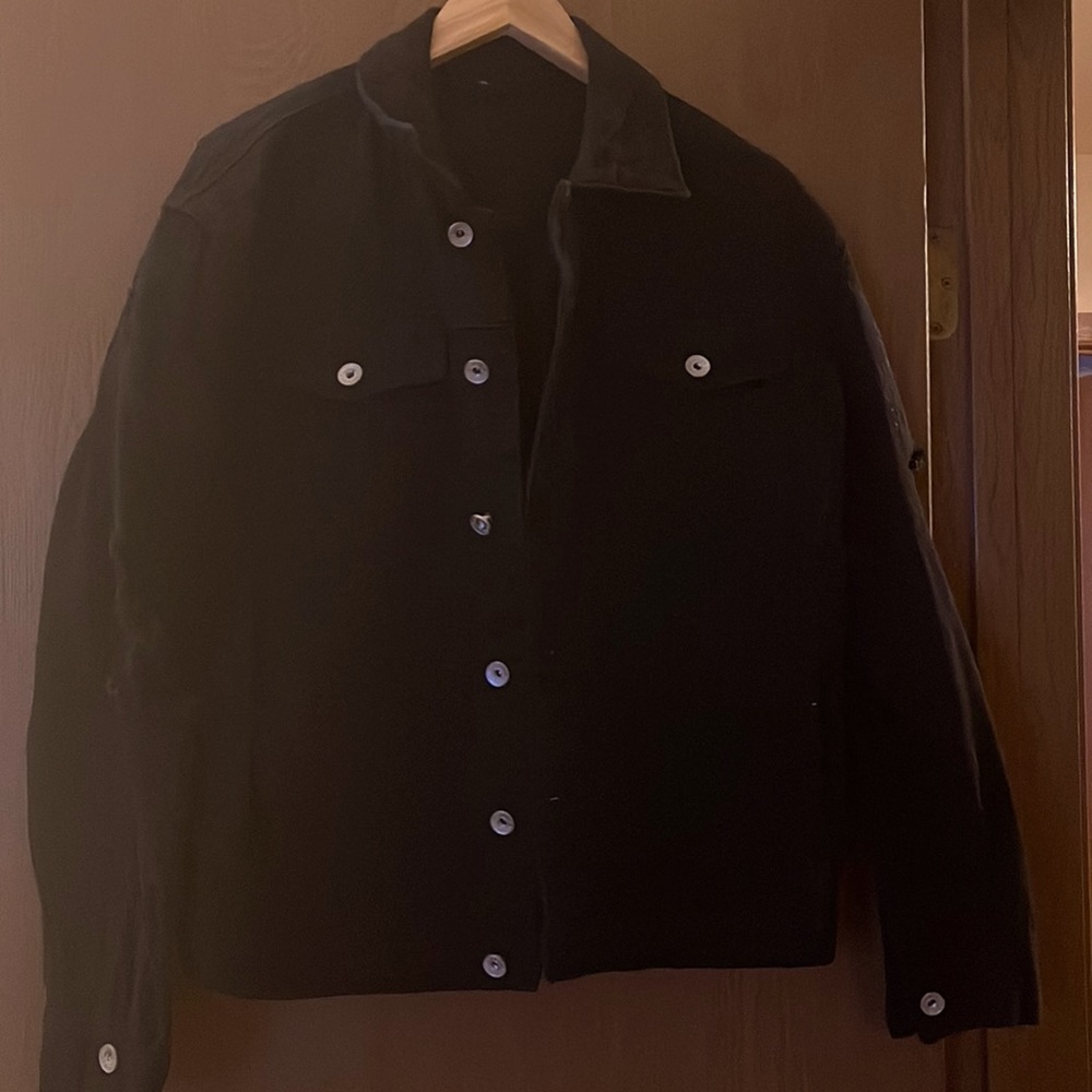 Black distressed jean jacket. Unisex.